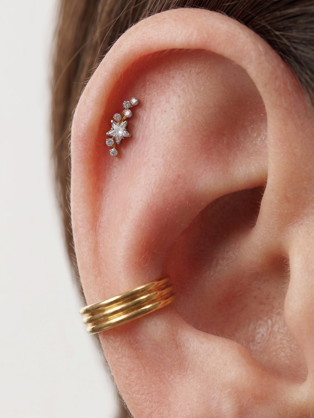 Close-up of the flat-back labret stud for helix, tragus and conch piercings, showing the finish detail