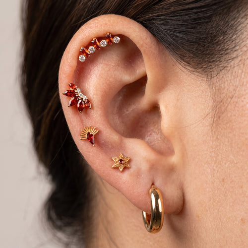 Close-up of the CZ (cubic zirconia) flat-back labret stud for helix, tragus and conch piercings, showing the finish detail