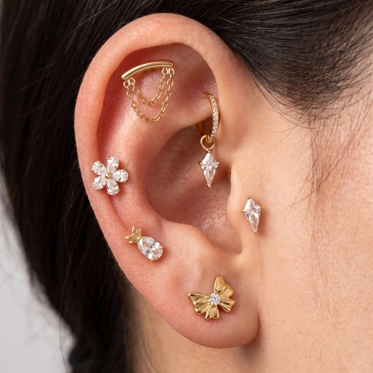 Close-up of the CZ (cubic zirconia) flat-back labret stud for helix, tragus and conch piercings, showing the finish detail