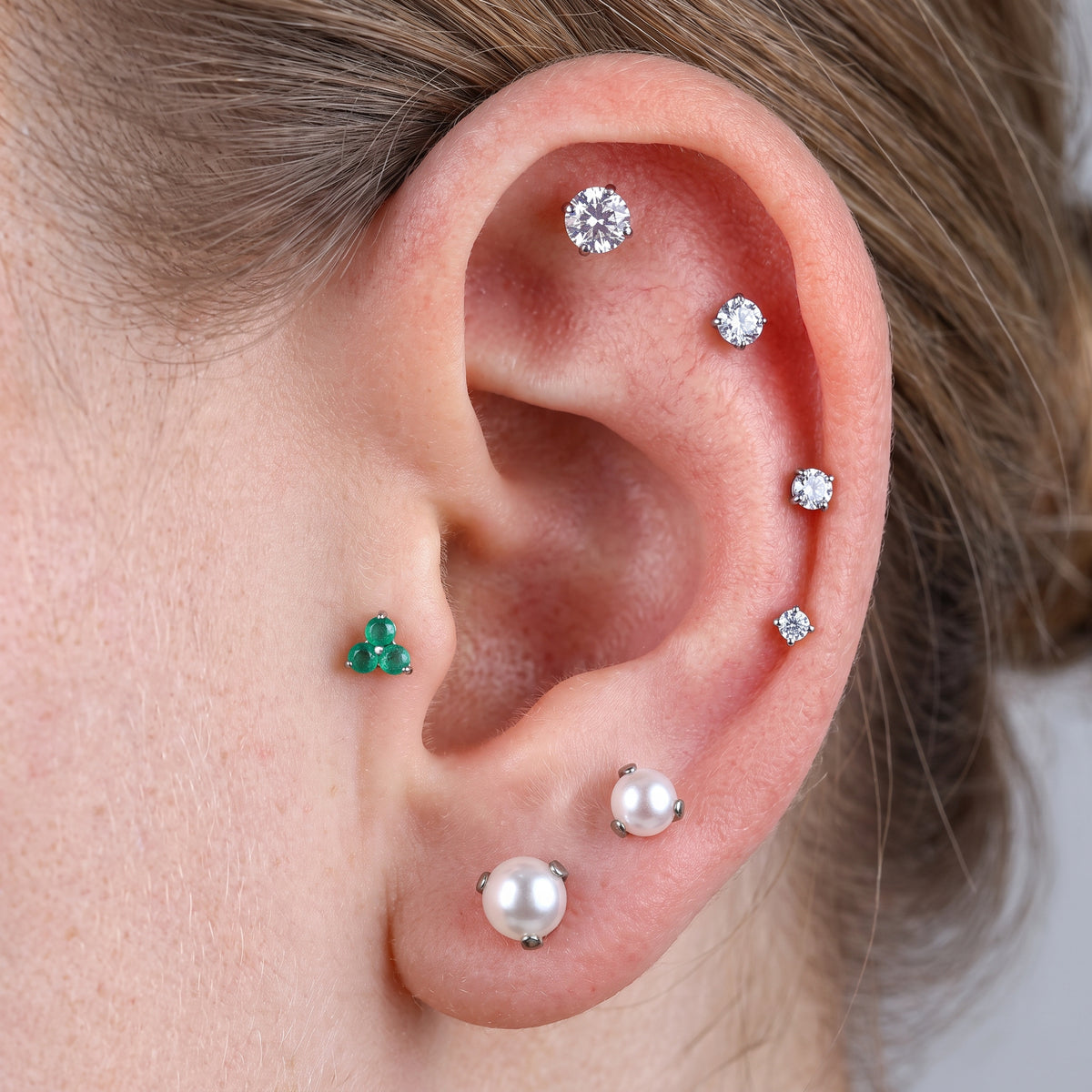 Close-up of the CZ (cubic zirconia) flat-back labret stud for helix, tragus and nostril piercings, showing the finish detail