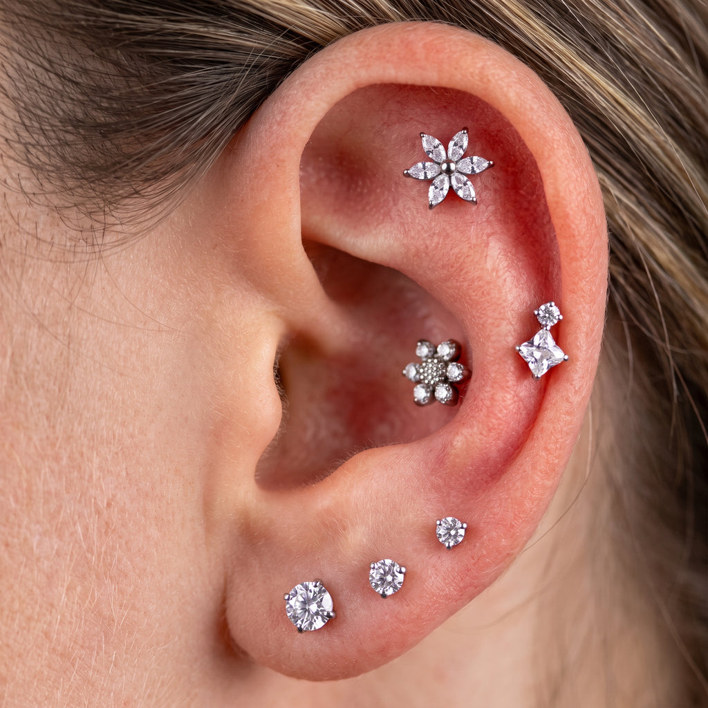 Close-up of the CZ (cubic zirconia) flat-back labret stud for helix, tragus and conch piercings, showing the finish detail