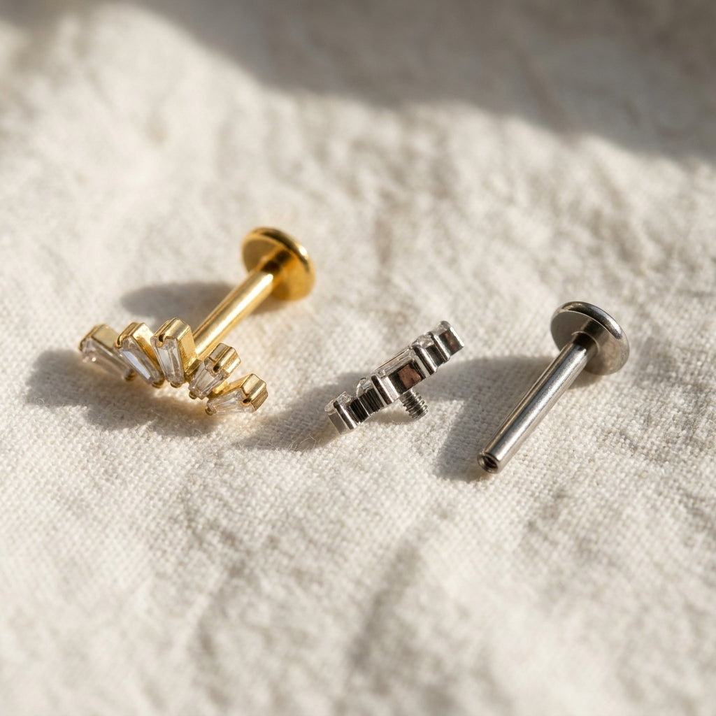 Detail view of the flat-back labret stud's flat back post, used for helix, tragus and conch piercings