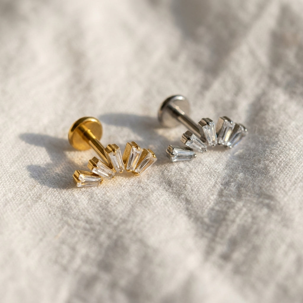 Styled shot of the titanium CZ (cubic zirconia) flat-back labret stud shown for helix, tragus and conch piercings