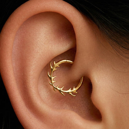 Close-up of the hinged clicker hoop for septum, daith and helix piercings, showing the finish detail
