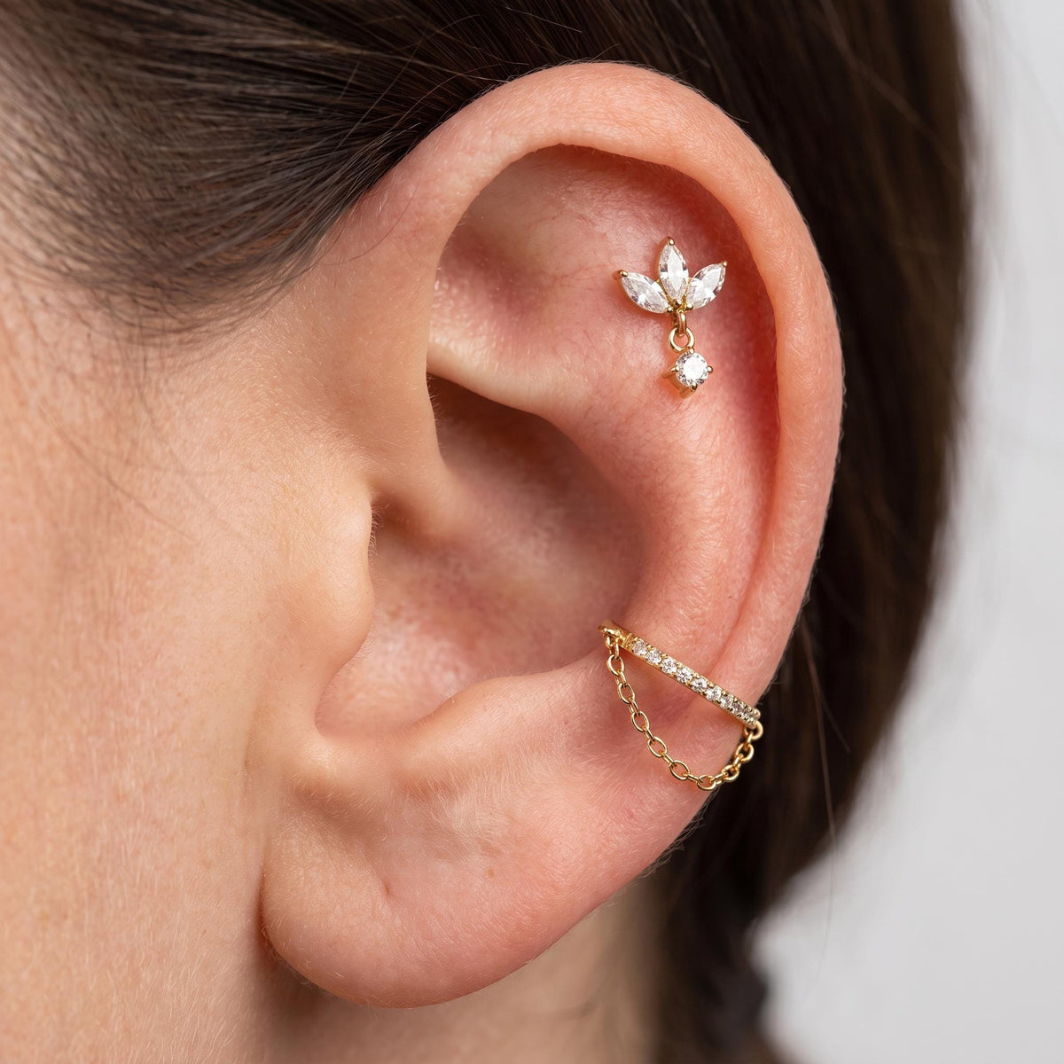 Close-up of the marquise CZ fan setting on the titanium labret stud, showing the finish detail