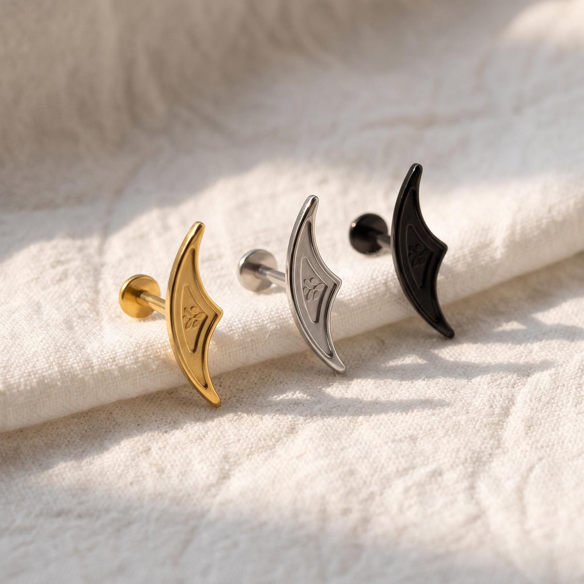 Styled shot of the titanium gothic hidden helix stud shown for cartilage piercings
