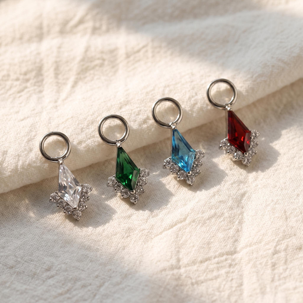 Close-up of the kite-cut CZ dangle charm, showing the finish detail