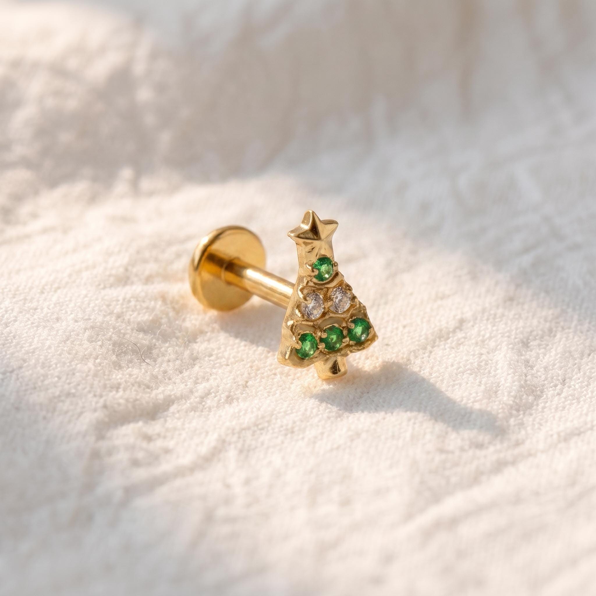 Detail view of the flat-back stud's flat back post, used for helix and tragus piercings