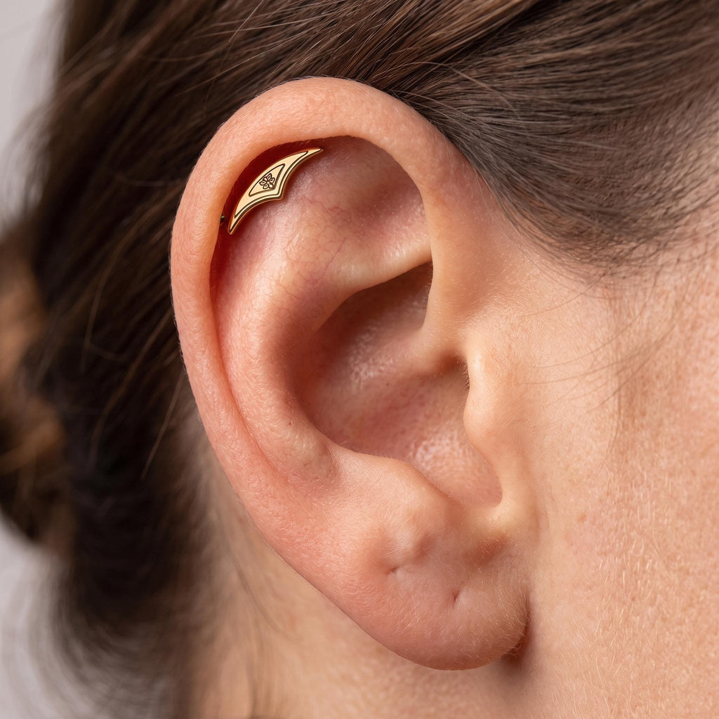 Close-up of the tattoo-line detail on the titanium gothic hidden helix stud, showing the finish detail