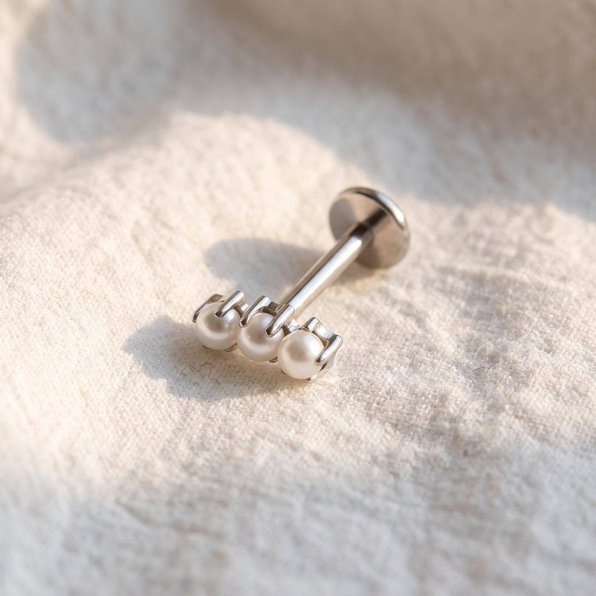 Front view of the titanium flat-back stud designed for helix, tragus and conch piercings