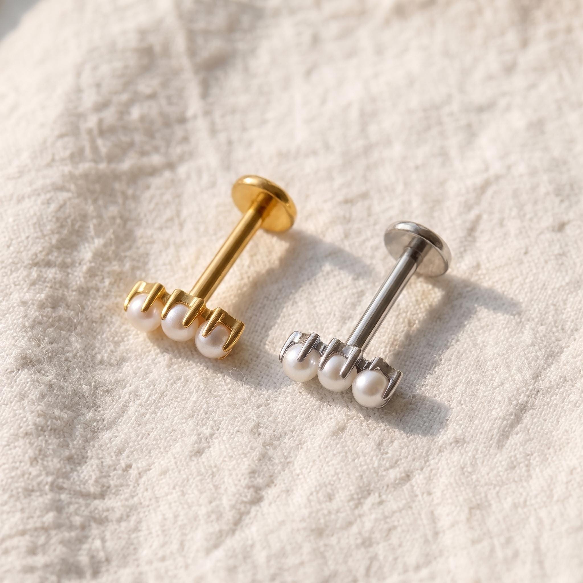Detail view of the internally threaded stud's post, used for helix and conch piercings