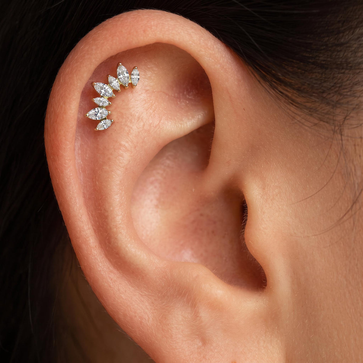 Close-up of the curved marquise CZ climber setting on the titanium stud, showing the finish detail