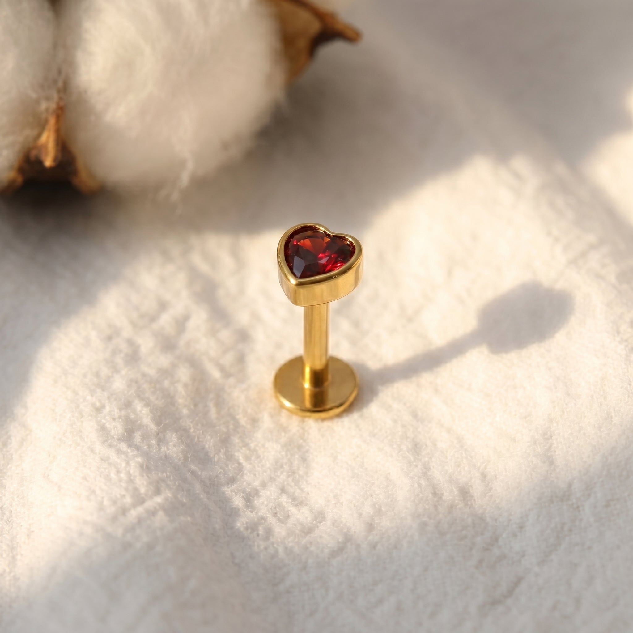 Titanium flat back stud shown at a different angle